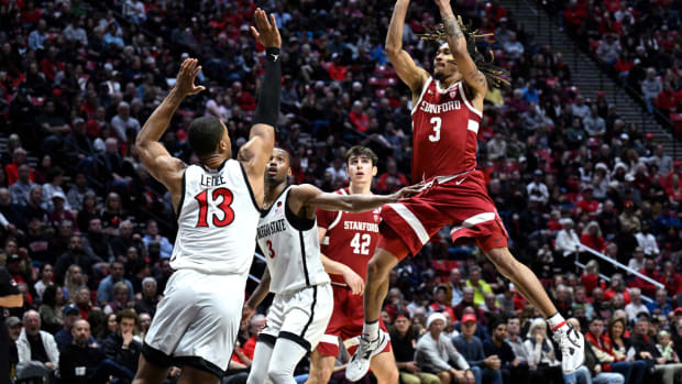 Dec 21, 2023; San Diego, California, USA; Stanford Cardinal guard Kanaan Carlyle (3) shoots the ball over San Diego State Aztecs forward Jaedon LeDee (13) during the second half at Viejas Arena. Mandatory Credit: Orlando Ramirez-USA TODAY Sports